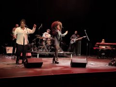 Ammoye-performing-on-stage-with-her-band