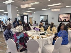 Bishop-Afolabi-and-wife-sitting-and-surrounded-by-other-pastors