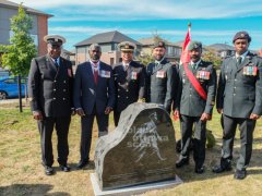 9.-Military-officers-pose-for-a-group-photograph-beside-the-newly-unveiled-No.-2-Construction-Battalion-monument