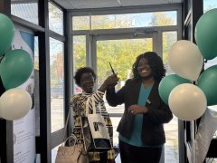 Dr.-Danielle-Brown-Shreves-raised-her-hands-in-triumph-smiling-broadly