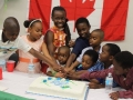 children having fun with independence cake