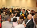 Sudanese community members and guest surrounding Abuaraki with love and admire during Ottawa concert