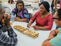 6.-Attendees-play-Awale-during-the-traditional-African-games-session-at-Threads-of-Wisdom