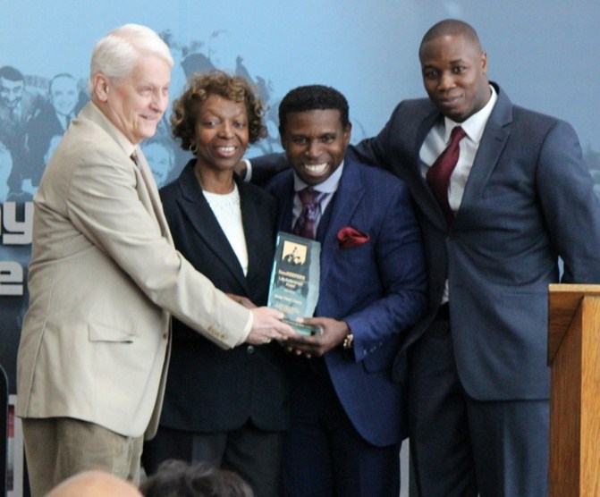 Mike "Pinball" Clemons poses with Dreamkeepers' team