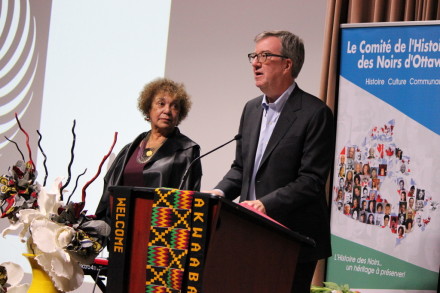 Mayor Jim Watson reads the Black History Month proclamation, with BHO Acting President June Girvan